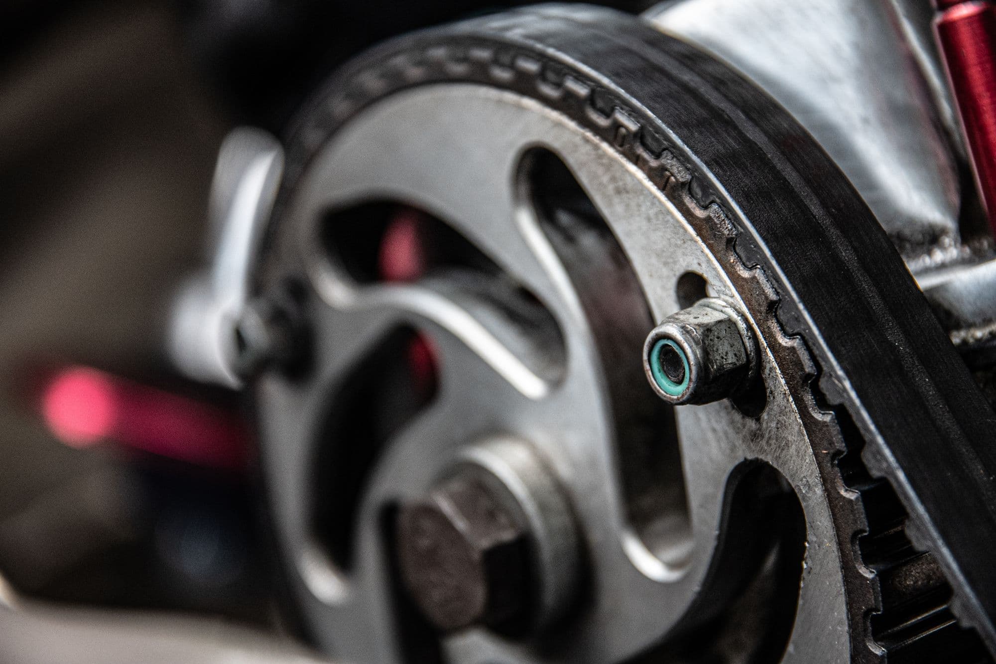 A timing belt on its camshaft sprocket
